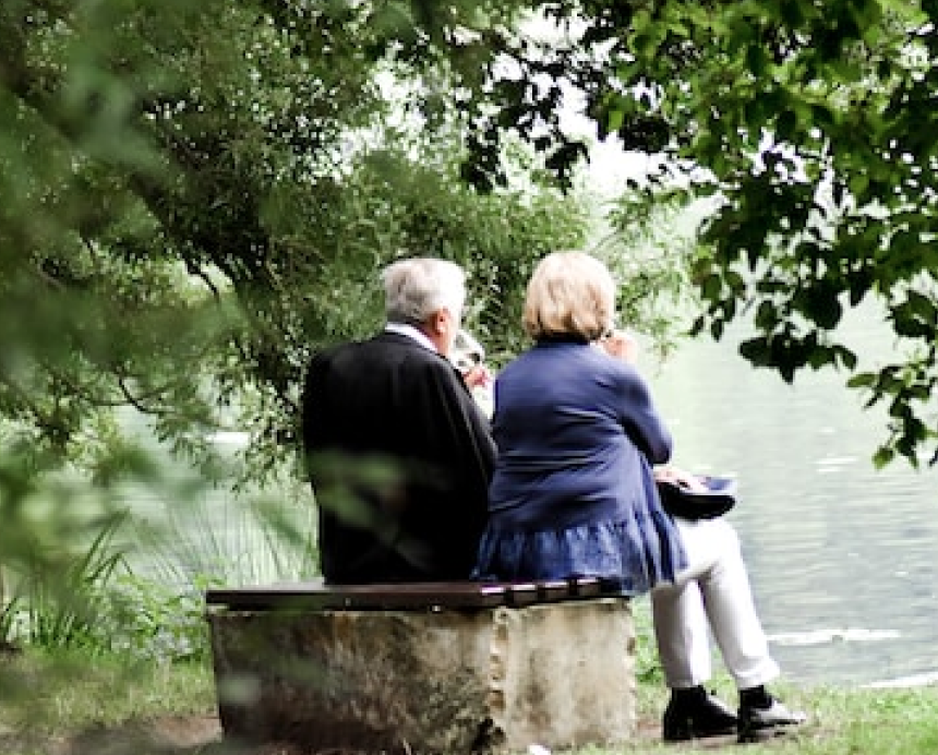 Two people sitting on a bench together